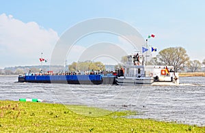 Barge at Elbe river. landscape in saxony anhalt Germany. Willow trees and meadows