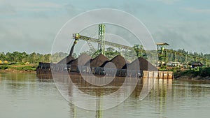 Barge full of coal. coal stockpile