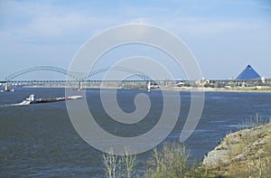 Barge on Mississippi River with Bridge and Memphis, TN in background