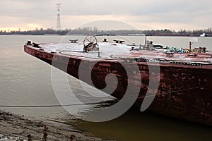 Barge moored at the coast of the Mississippi river.