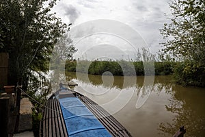 barge moored in the port of La Albufera on a gray day