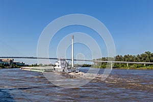 A barge moving northwards on River Missouri at Omaha