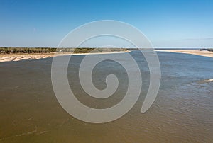 Barge in narrow channel of Mississippi river near Vicksburg MS in October 2023