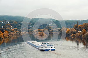 A barge navigates the Mosel River near Trier, Germany photo