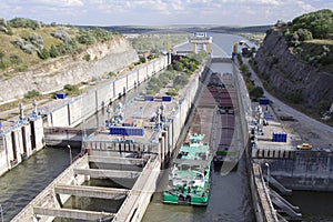 Barge passing through canal lock