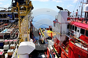 A barge platform with a supply vessel