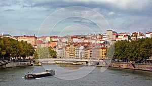 A barge on RhÃ´ne river in city of Lyon France