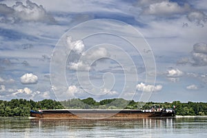 barge sailing on the Danube river in eastern Europe