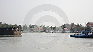 Barge and Tug Boat cargo ship in Choaphraya river at Ayutthaya Thailand