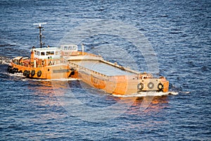 Barge and tug on river