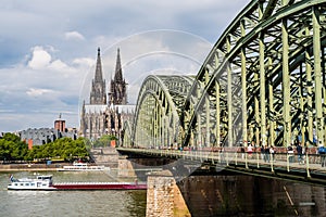 Barge under Hohenzollern Bridge by Cologne Cathedral, Germany