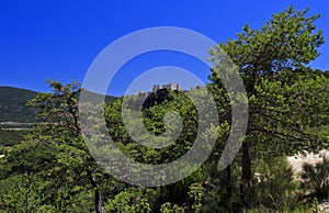 Bargeme Castle rising above the thickly forested Var