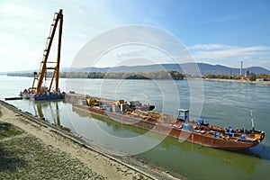 Barges with construction equipment