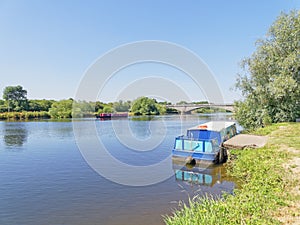 Barges moored along the banks of the River Trent.