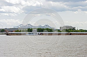 Barges and Tugboat on Mississippi River in New Orleans