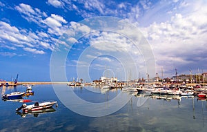 Bari, Italy, Puglia: Beautiful landscape with fishing boats, yaght and blue sea against the sky