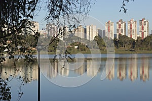 Reflection of the buildings on the lake. photo