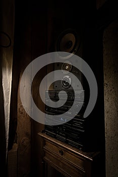 BARILOCHE, ARGENTINA, JUNE 18, 2019: Close up of old stereo music sound system with the radio on as background ambientation on a