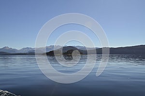 Bariloche, Argentina. People aboard a boat feeding biscuits to the seagulls on Lake Nahuel Huapi