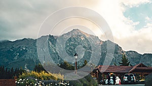 Bariloche Argentina rocky hill with rustic buildings and people