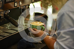 Barista cafe making fresh coffee by machine