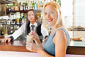 Barista with client in his cafe or coffeeshop