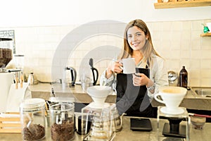 Barista with a cup of coffee