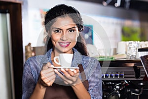 Barista with espresso in Indian cafe