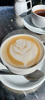 Barista froth art on latte.