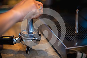 Barista hand making coffee from the machine