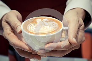 Barista Holding The Cup Of Coffee Service Concept