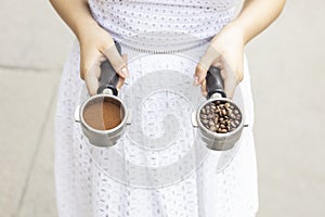 Barista holds a coffee horn on street