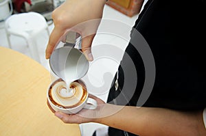 Barista made a latte art photo