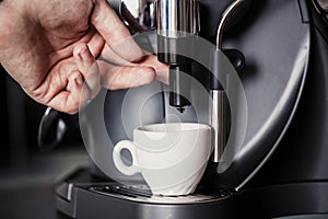 Barista makes coffee with a machine