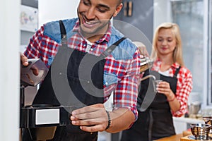 Barista making coffee shop staff man and woman happy smile