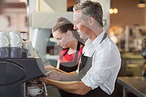 Barista making cup of coffee