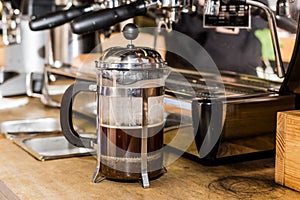 Barista making non traditional coffee in french press