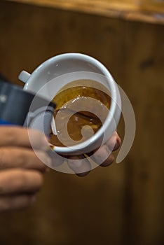 Barista pouring latte froth make coffee latte art