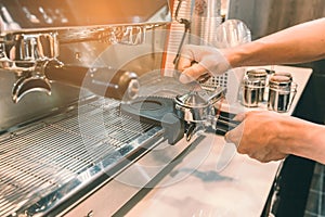 Barista prepare a cofee for extract in coffee machine.