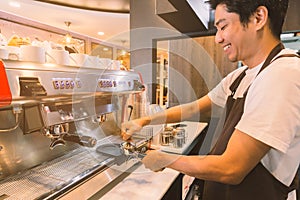 Barista prepare a coffee for extract in coffee machine.