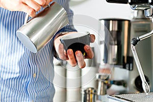 Barista prepares espresso