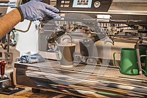 Barista preparing coffee in takeaway cups in coffee shop. Professional Coffee Brewing in Coffee Haven