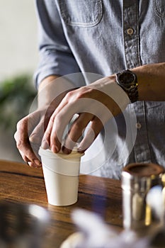 Barista preparing coffee to go