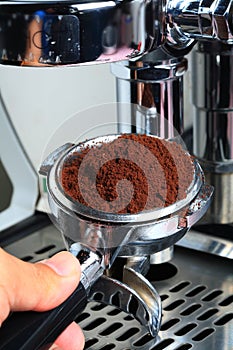 Barista take coffee grind to making Espresso