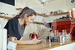 Barista taking order from customer online on smartphone. Concept of cafe and coffee shop small business