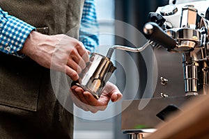 Barista Warming Milk In Metal Jug With Steam Of Coffee Machine. Coffee Preparation At Home. Quarantine