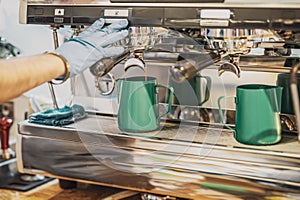 Barista working making coffee with coffee machine