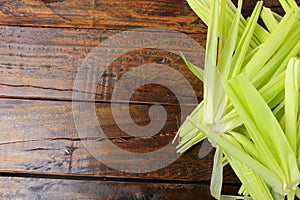 Bark and green corn straw, harvested from plantation, on rustic wooden table
