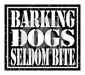 BARKING DOGS SELDOM BITE, text written on black stamp sign
