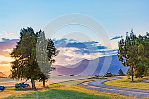 Barley field with a backdrop of the Southern Alps at sunset in Wanaka Otago New Zealand